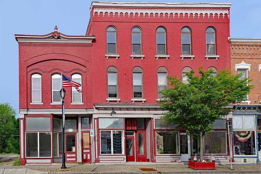 Business Insurance - View of Multiple Colorful Small Commercial Buildings Along the Main Street of a Small Town