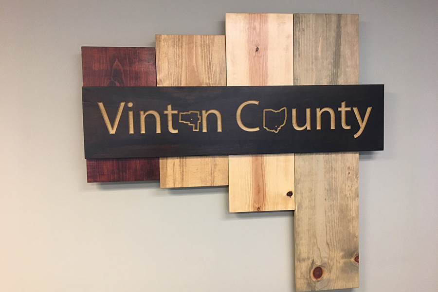 Community Involvement - Decorative Wooden Sign of Vinton County Ohio in the Booth Insurance Agency Office